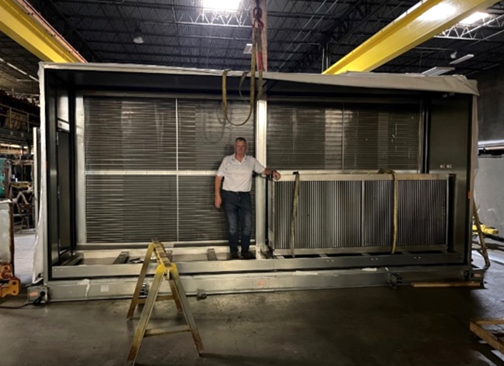 Darrell Sandlin President CHP with Commerical HVAC Unit at Install