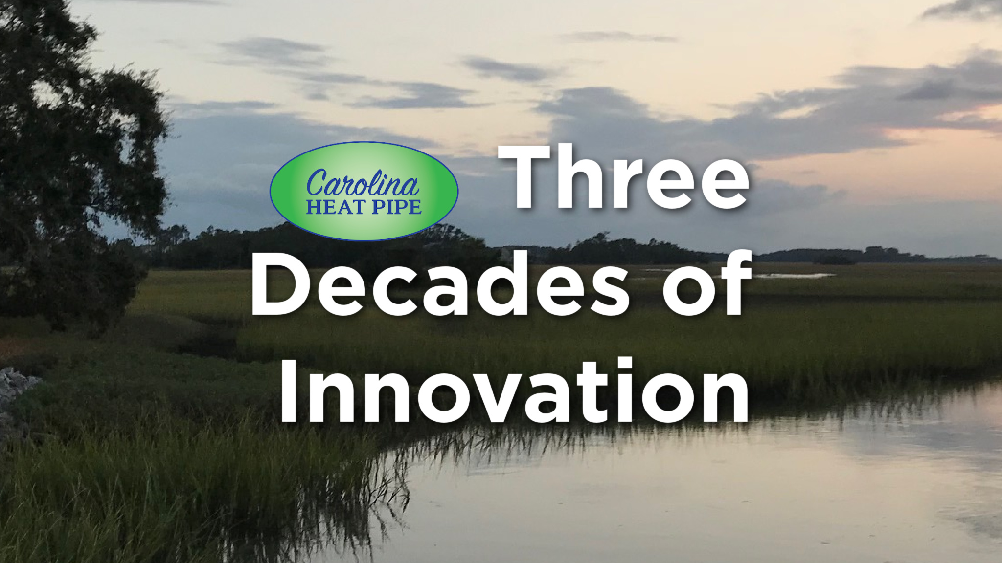 Outside view of marshland at sunset and the words three decades of innovation