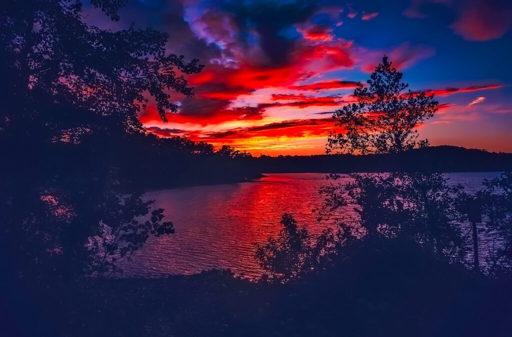 Sunset picutre on lake lanier with reds and blue colors in the sky